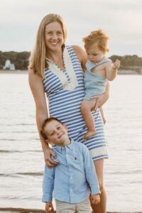 A mother and her two young children at the beach