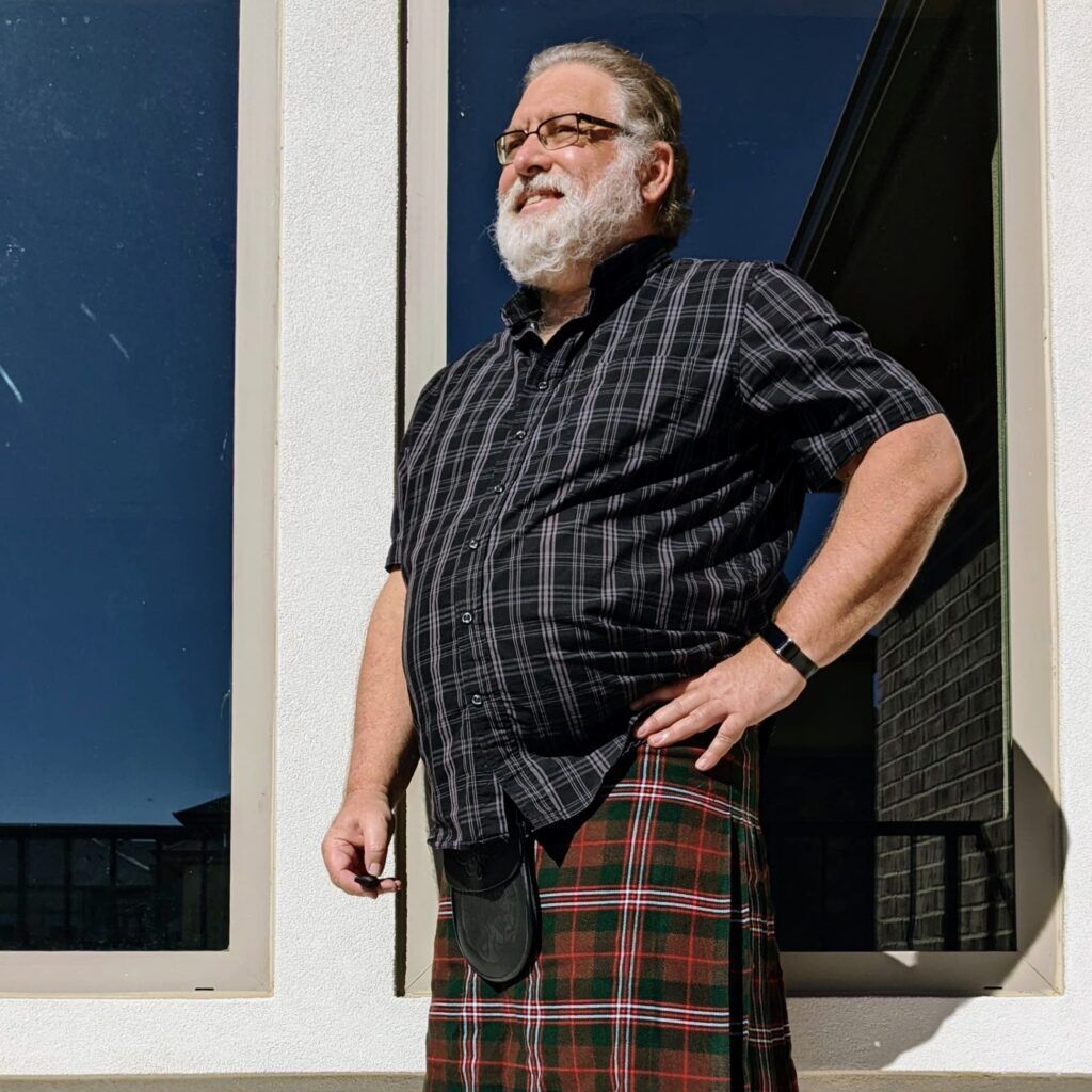 Man in traditional Scottish kilt outfit